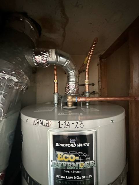 Residential plumber working in a Norwalk, CA home